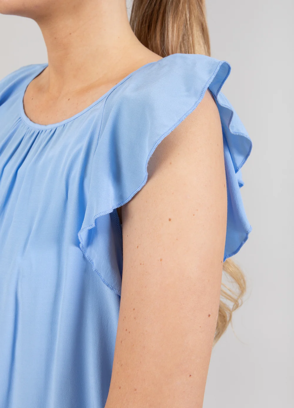 Top with ruffle sleeves sky blue